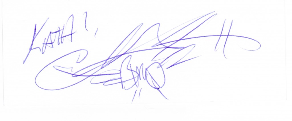 Blue ink signature with illegible handwriting.