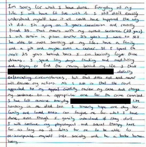 Handwritten letter with redacted text sections.